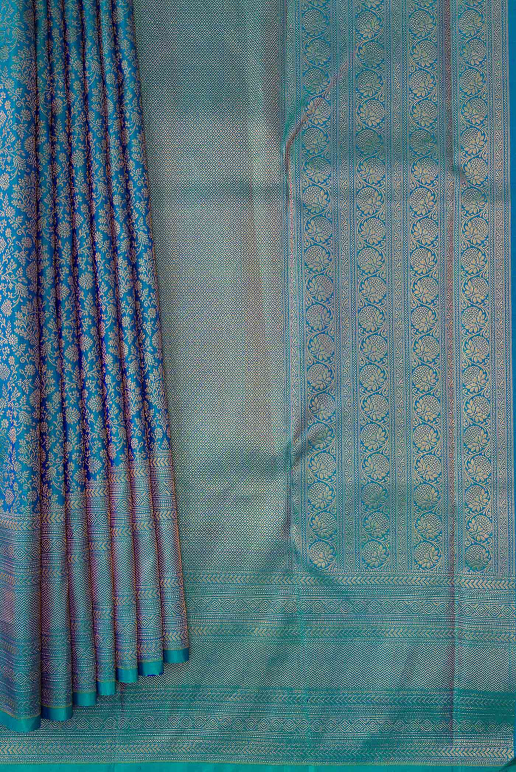 Pleats and pallu of Peacock Blue Dual Tone Kanjivaram Silk Saree with Zari Brocade on the body and Zari Border. 