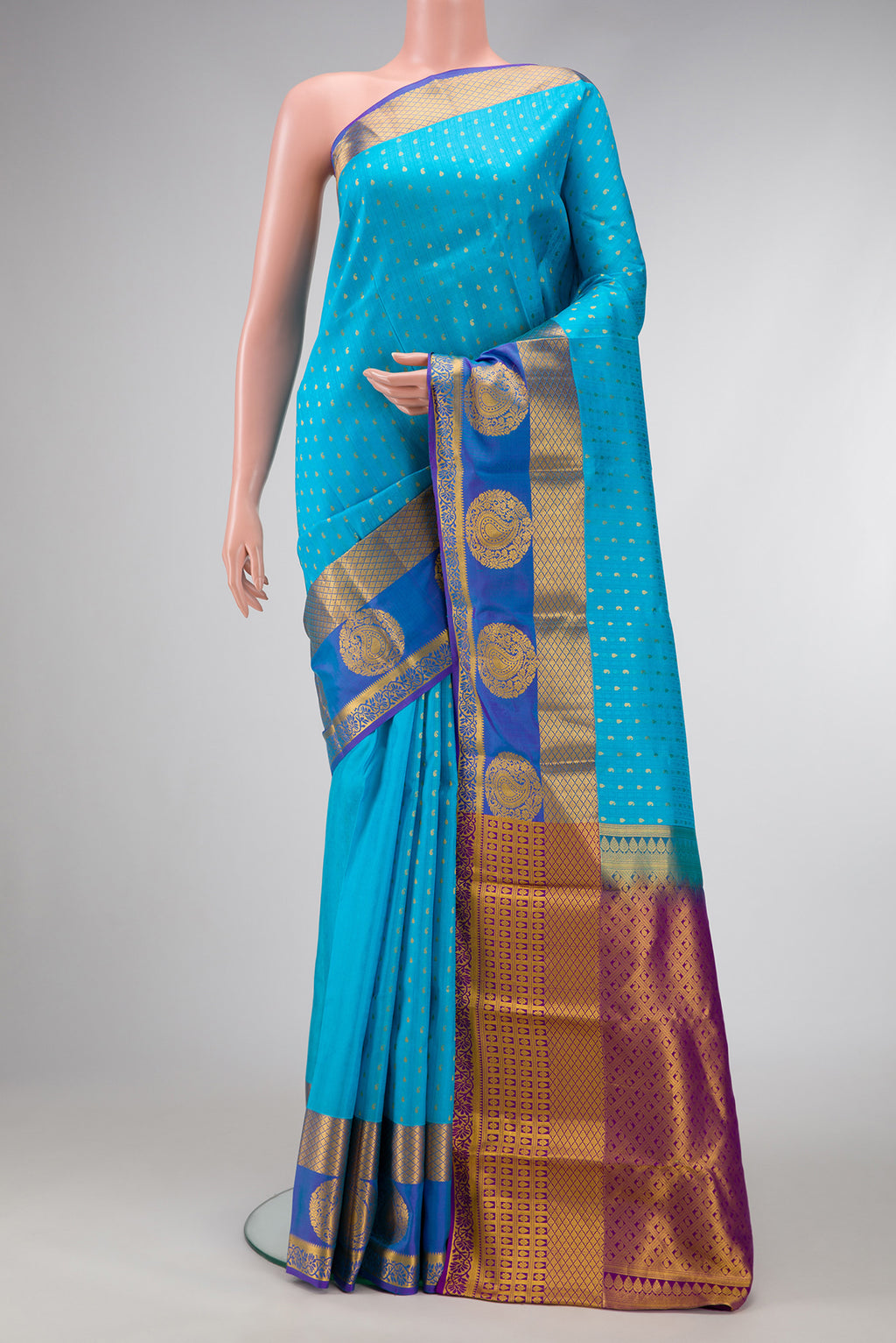 Sky Blue Dual Tone Kanjivaram Silk Saree with Jacquard With Zari Butta on the body and Fancy Border.  displayed on a mannequin