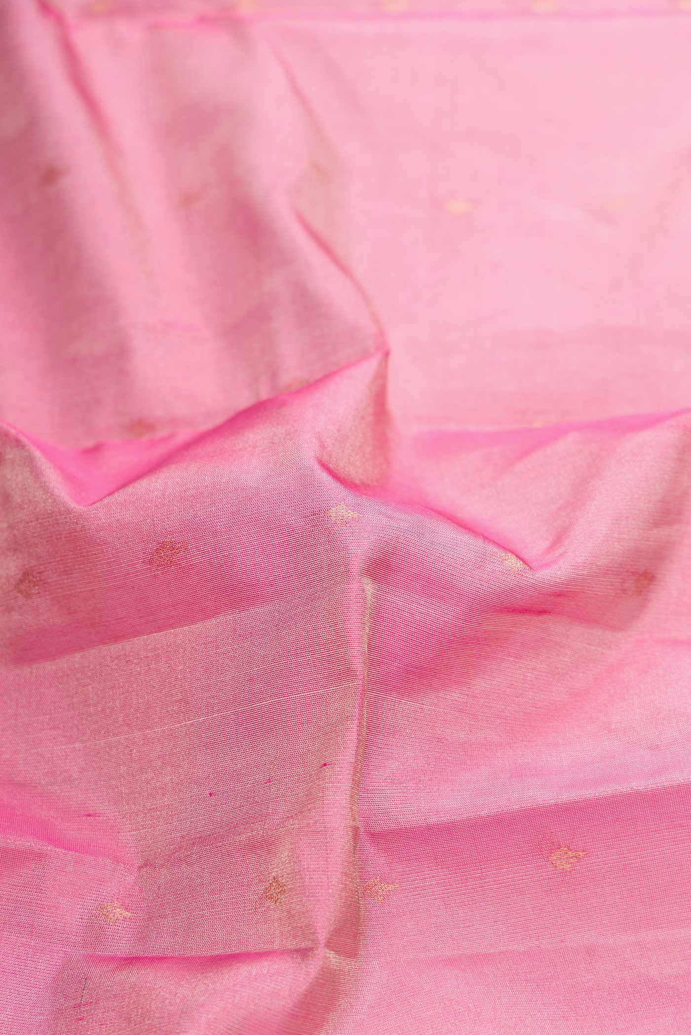 Close up of Pink Dual Tone Kanchipuram Tissue Silk Saree with Zari Brocade on the body and Plain Border displaying folds