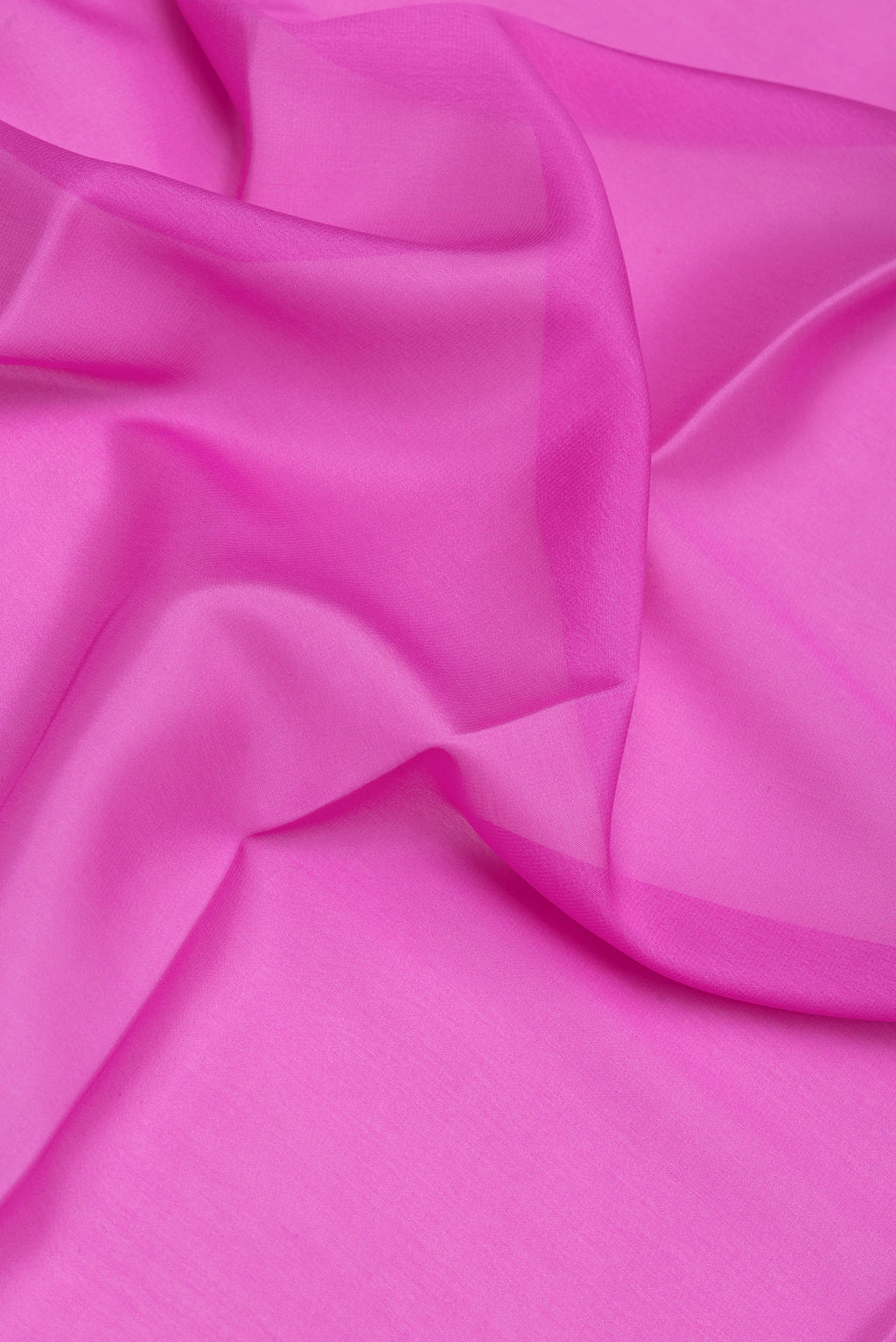 Close up of Pink Mysore Silk Saree with Plain Body and Zari Border.  displaying folds