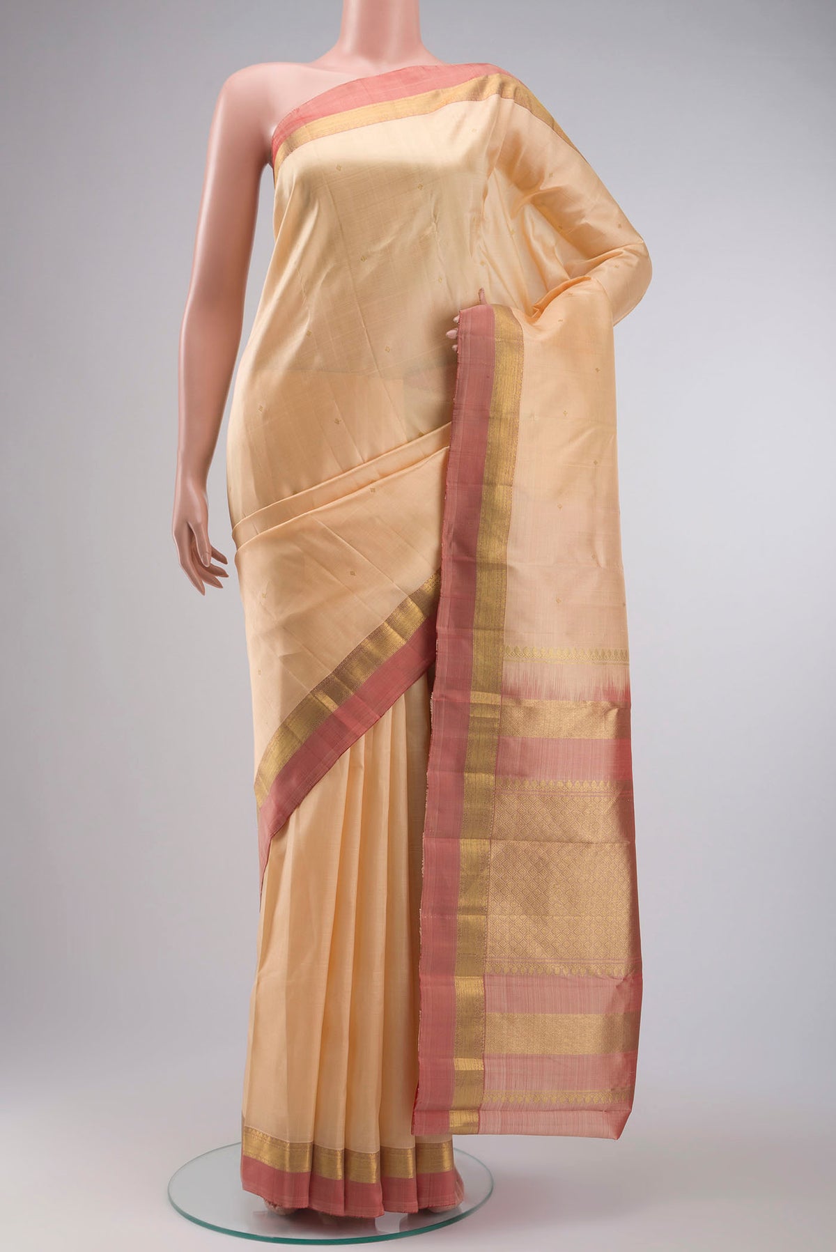 Sandal Kanchipuram Silk Saree with Zari Butta on the body and Zari Border displayed on a mannequin