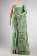 Pista Green Dual Tone Kanjivaram Silk Saree with Zari Brocade on the body and Zari Border.  displayed on a mannequin