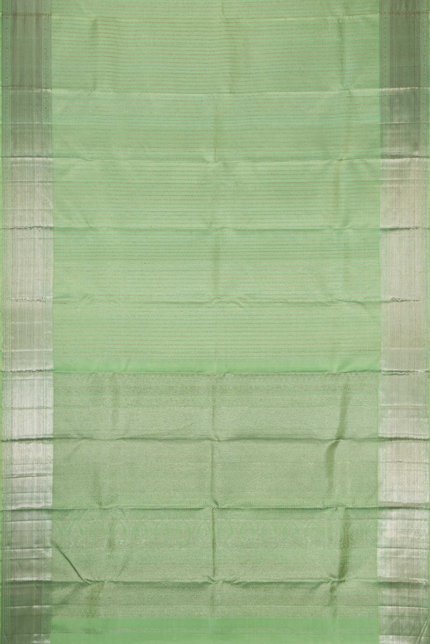 Flat view of Pista Green Dual Tone Kanjivaram Silk Saree with Zari Brocade on the body and Zari Border. 