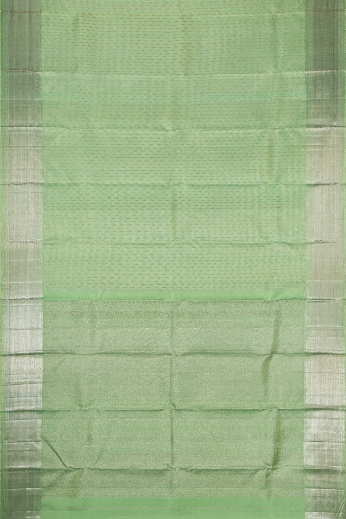 Flat view of Pista Green Dual Tone Kanjivaram Silk Saree with Zari Brocade on the body and Zari Border. 