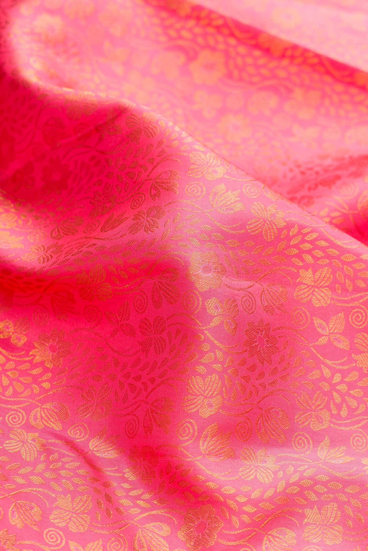 Close up of Pink Dual Tone Kanchipuram Silk Saree with Zari Brocade on the body and Zari Border displaying folds