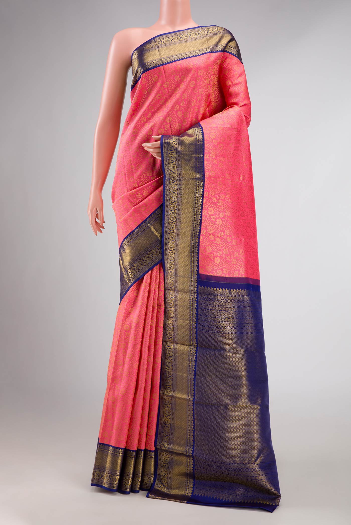 Pink Dual Tone Kanchipuram Silk Saree with Zari Brocade on the body and Zari Border displayed on a mannequin
