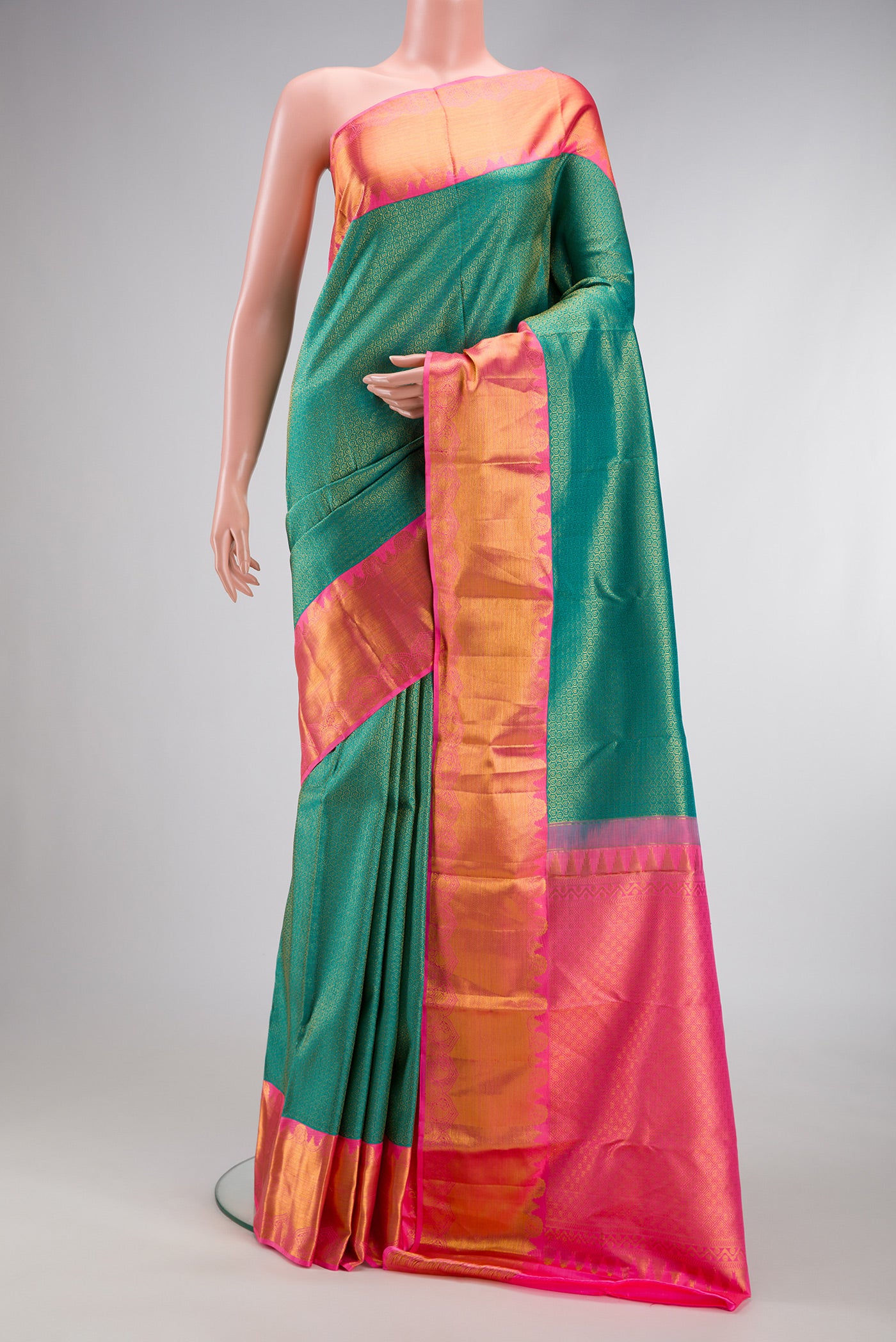 Sea Green Dual Tone Kanjivaram Silk Saree with Zari Brocade on the body and Zari Border.  displayed on a mannequin