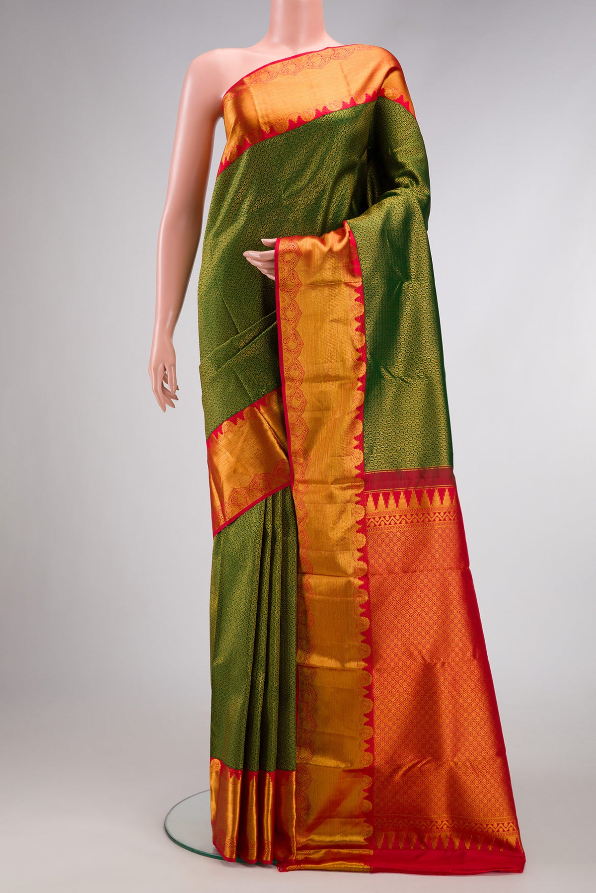 Green Dual Tone Kanjivaram Silk Saree with Zari Brocade on the body and Zari Border.  displayed on a mannequin