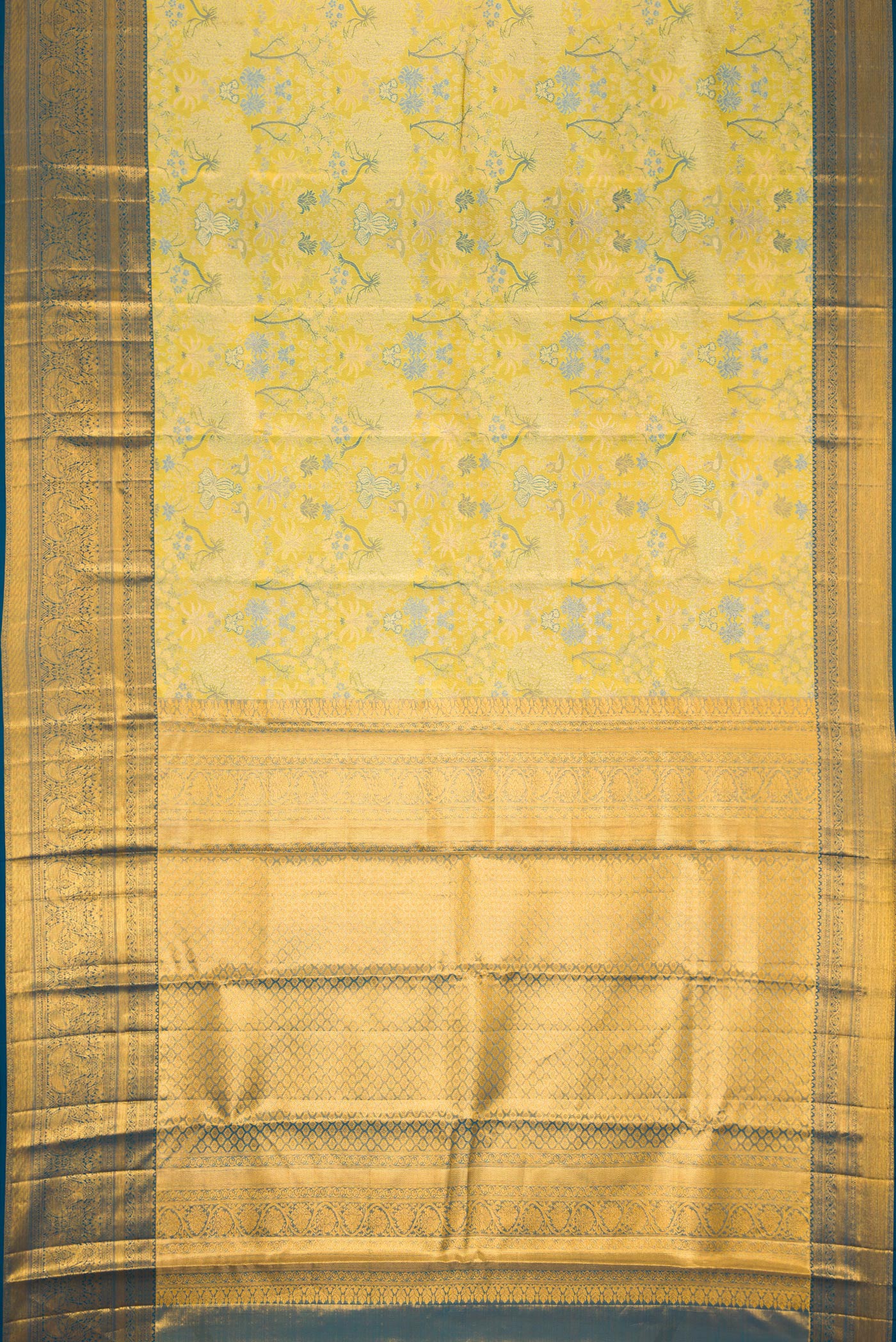Flat view of Green Dual Tone Kanchipuram Tissue Silk Saree with Zari Brocade on the body and Zari Border. 