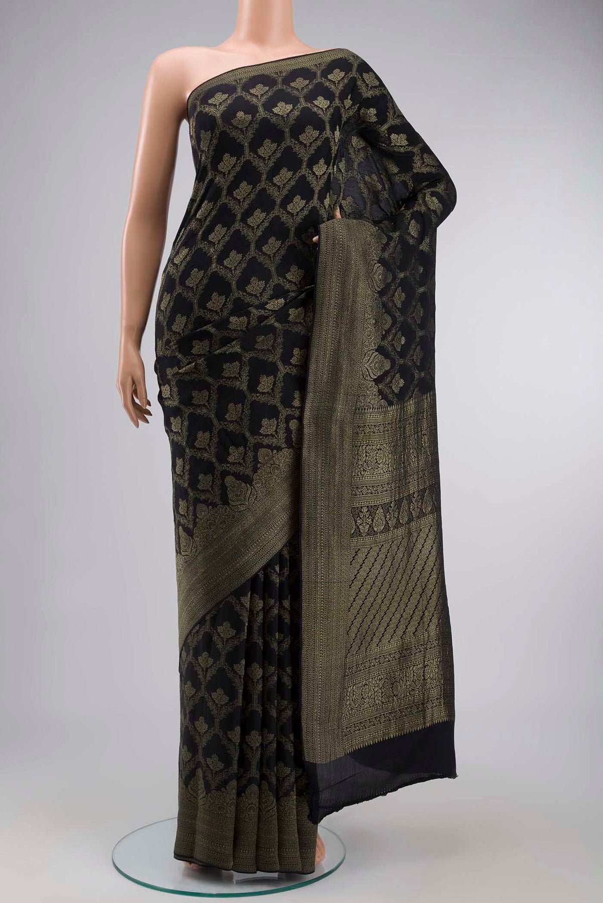 Black Mysore Crepe Saree with Zari Butta on the body and Zari Border displayed on a mannequin