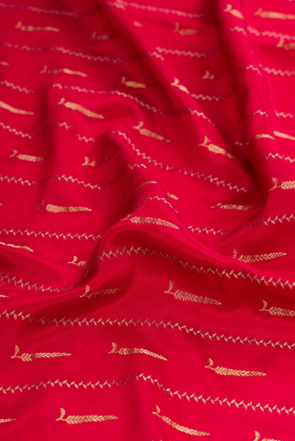 Close up of Maroon Dual Tone Mysore Georgette Saree with Stripes on the body and Zari And Thread Border.  displaying folds