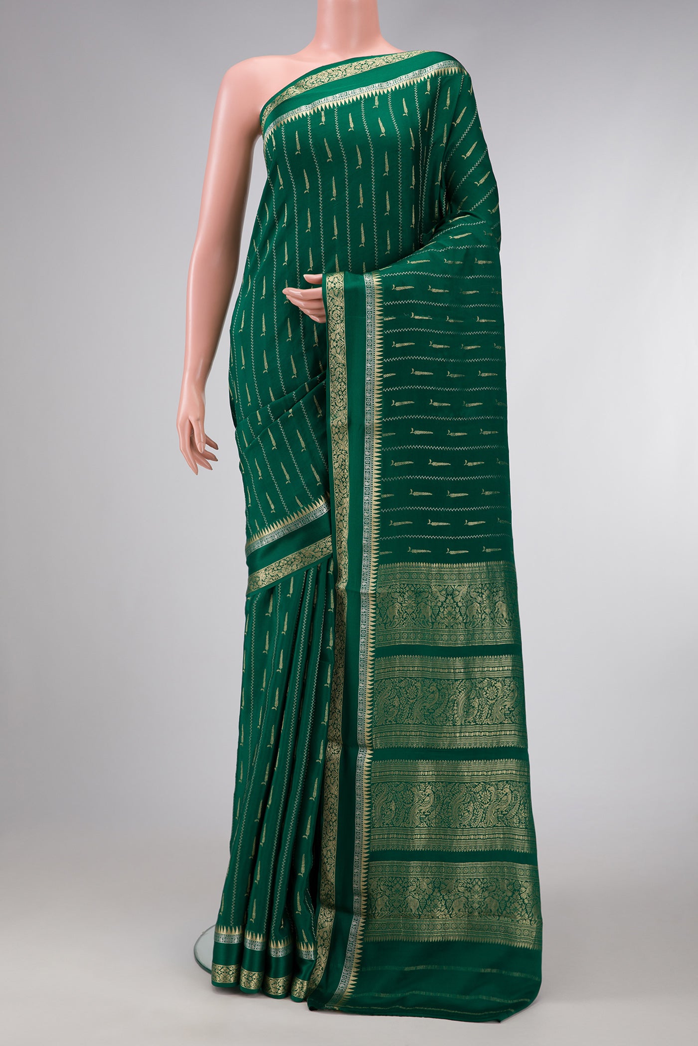 Bottle Green Dual Tone Mysore Silk Saree with Zari Butta on the body and Zari And Thread Border.  displayed on a mannequin