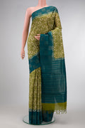 Mehandi Green Dual Tone Tussar Silk Saree with Printed design on the body and Fancy Border.  displayed on a mannequin