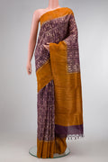 Purple Dual Tone Tussar Silk Saree with Printed design on the body and Zari Border.  displayed on a mannequin