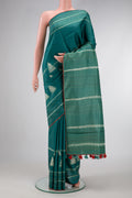 Green Dual Tone Tussar Silk Saree with Printed design on the body and Embroidery Border.  displayed on a mannequin