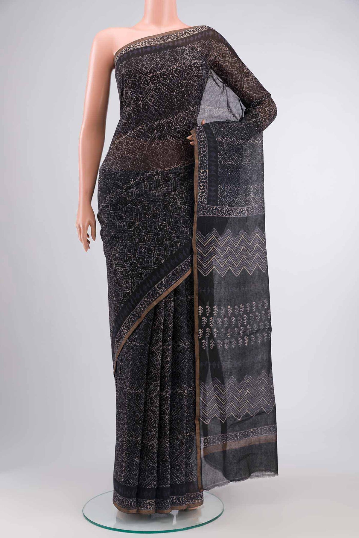 Black Kota Cotton SareePrinted design on the body and Zari Border displayed on a mannequin