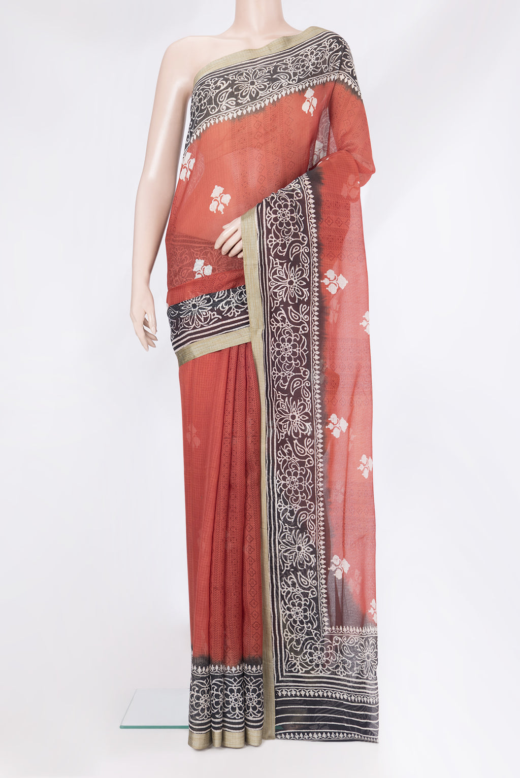 Maroon Kota Silk Saree with Printed design on the body and Printed Border.  displayed on a mannequin