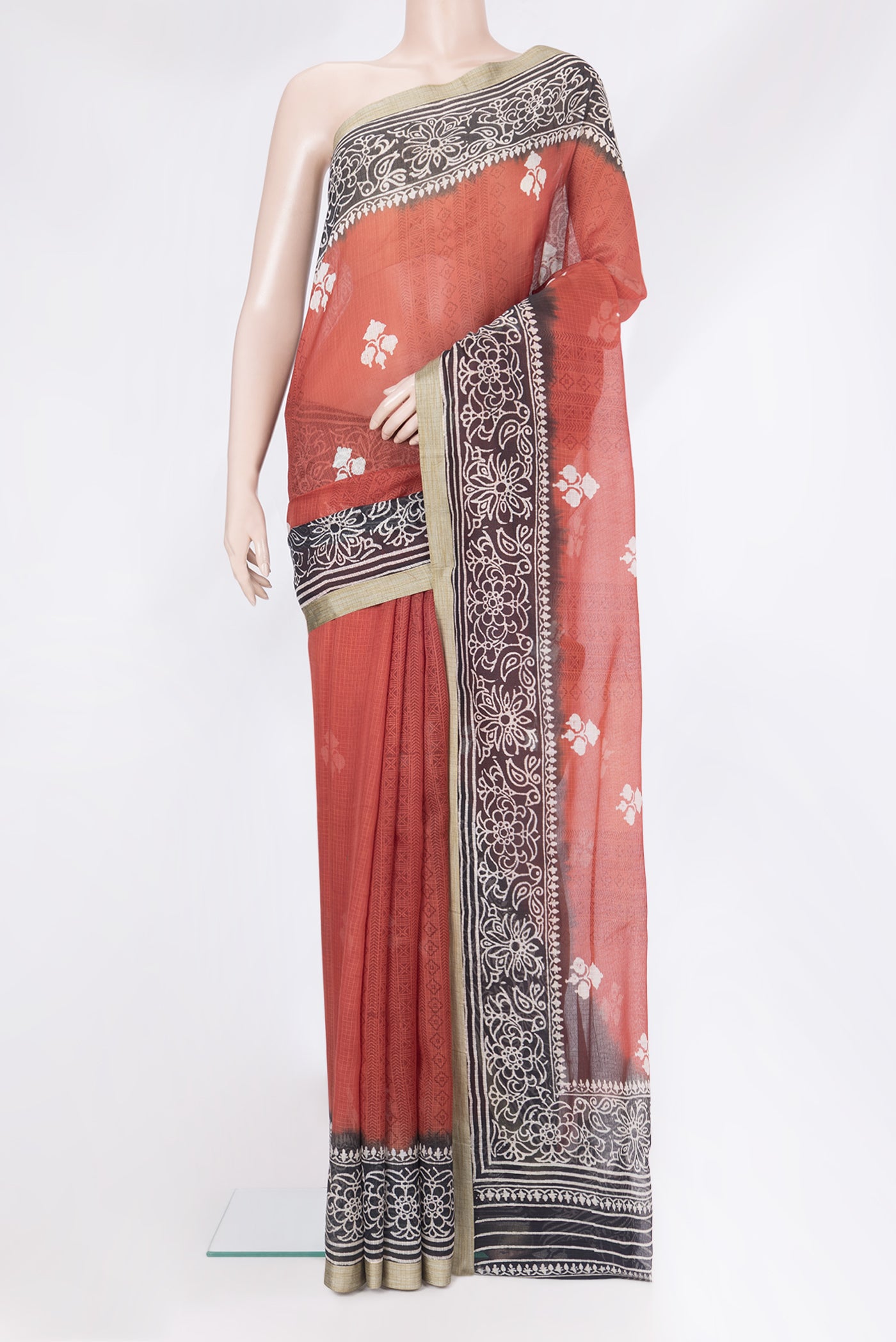 Maroon Kota Silk Saree with Printed design on the body and Printed Border.  displayed on a mannequin