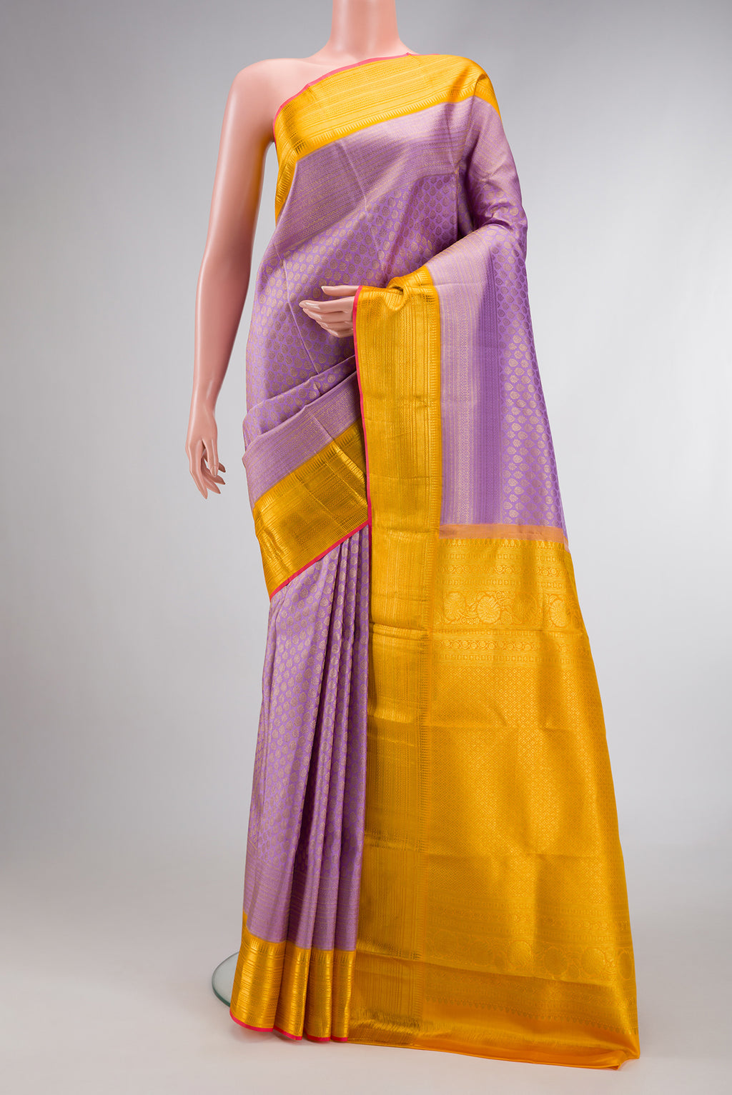 Lavender Dual Tone Kanchipuram Silk Saree with Zari Brocade on the body and Zari Border.  displayed on a mannequin