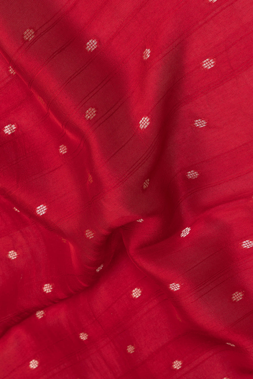 Close up of Red Blended Banarasi Silk Saree with Zari Butta on the body and Fancy Border.  displaying folds