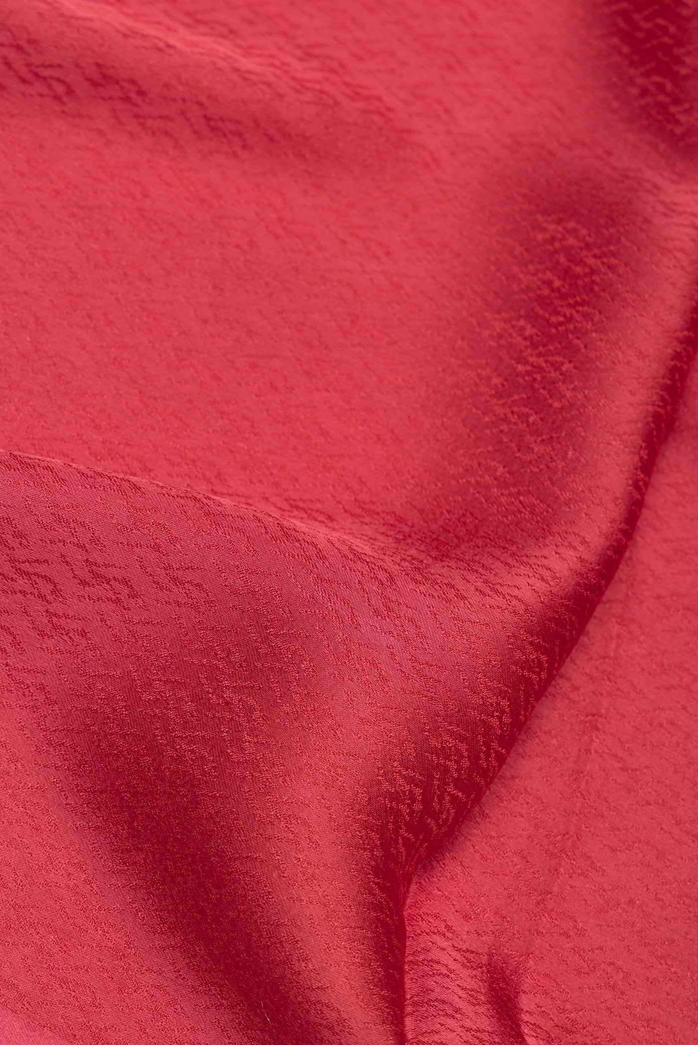Close up of Maroon Blended Banarasi Silk Saree with Jacquard design on the body and Fancy Border.  displaying folds