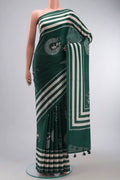Green Tussar Silk Saree with Zari Butta on the body and Plain Border displayed on a mannequin