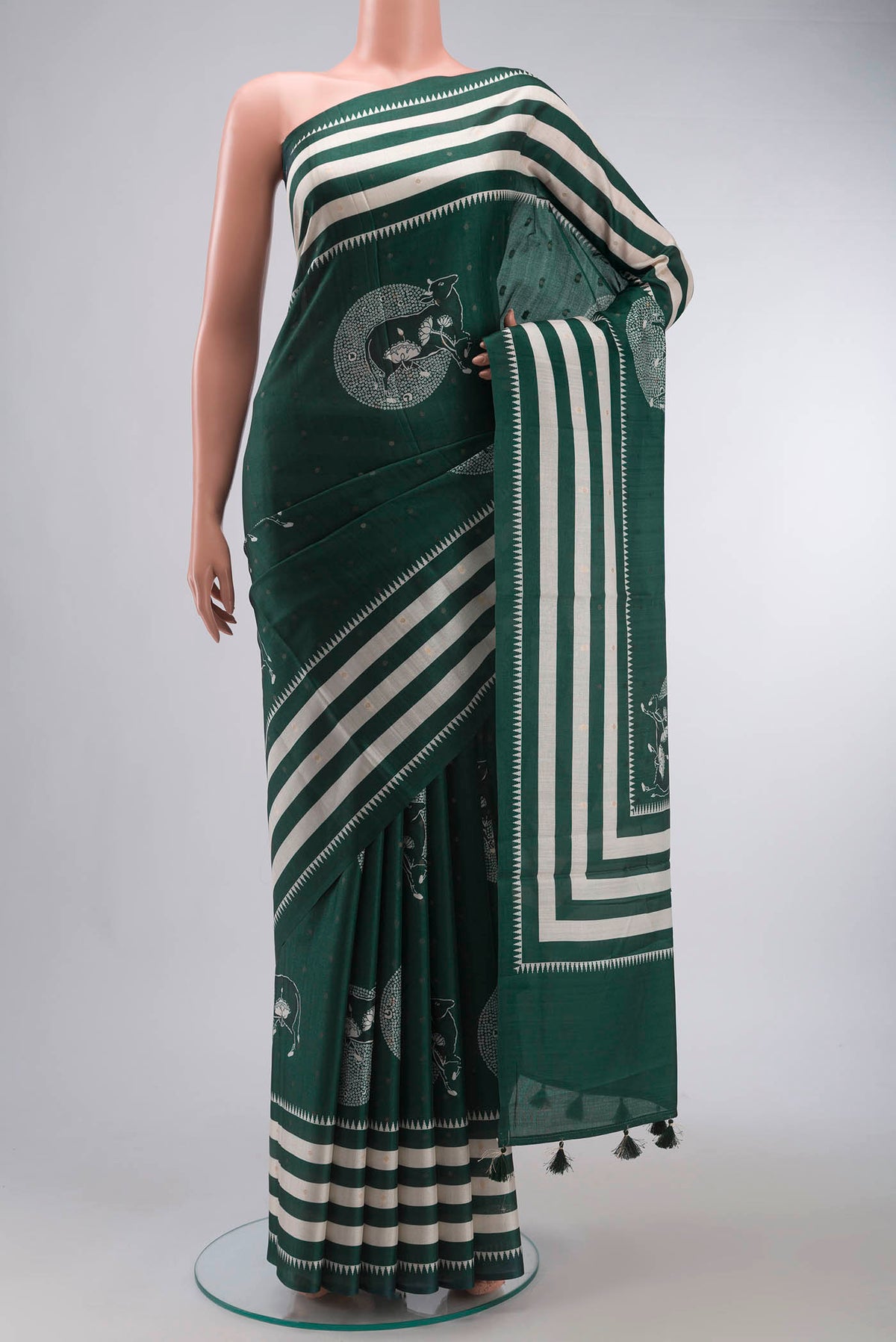 Green Tussar Silk Saree with Zari Butta on the body and Plain Border displayed on a mannequin