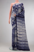 Navy Blue Dual Tone Tussar Silk Saree with Printed design on the body and Printed Border.  displayed on a mannequin