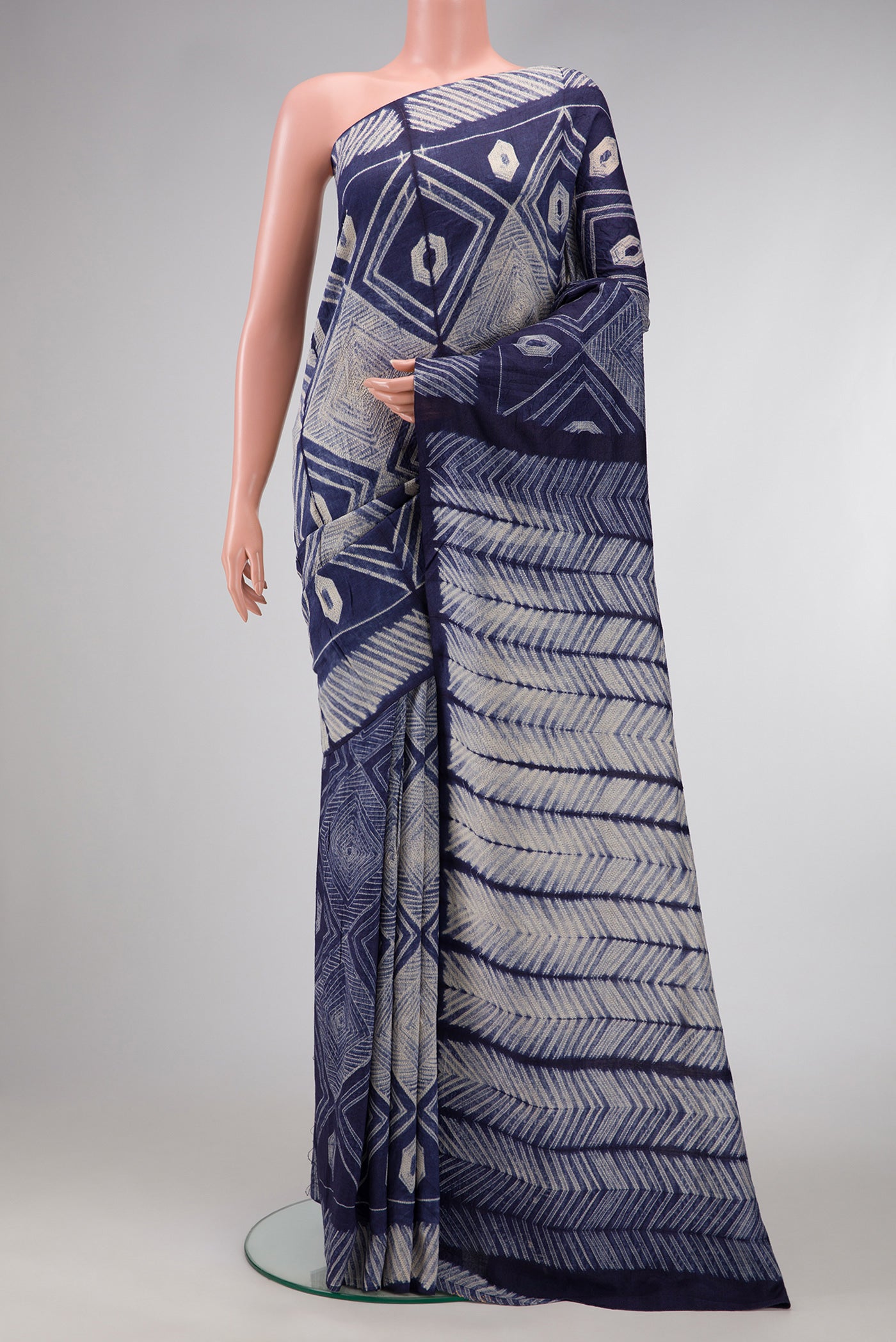 Navy Blue Dual Tone Tussar Silk Saree with Printed design on the body and Printed Border.  displayed on a mannequin