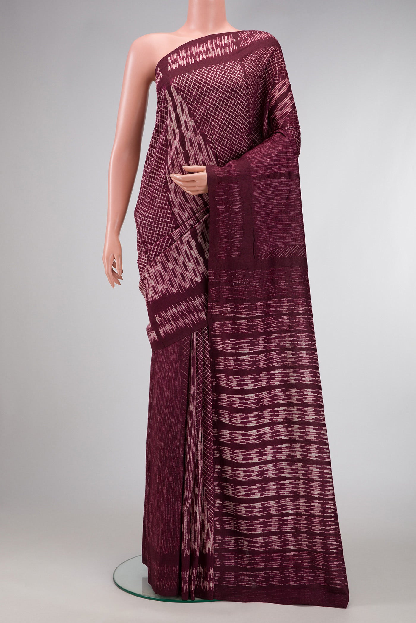Maroon Dual Tone Tussar Silk Saree with Printed design on the body and Printed Border.  displayed on a mannequin