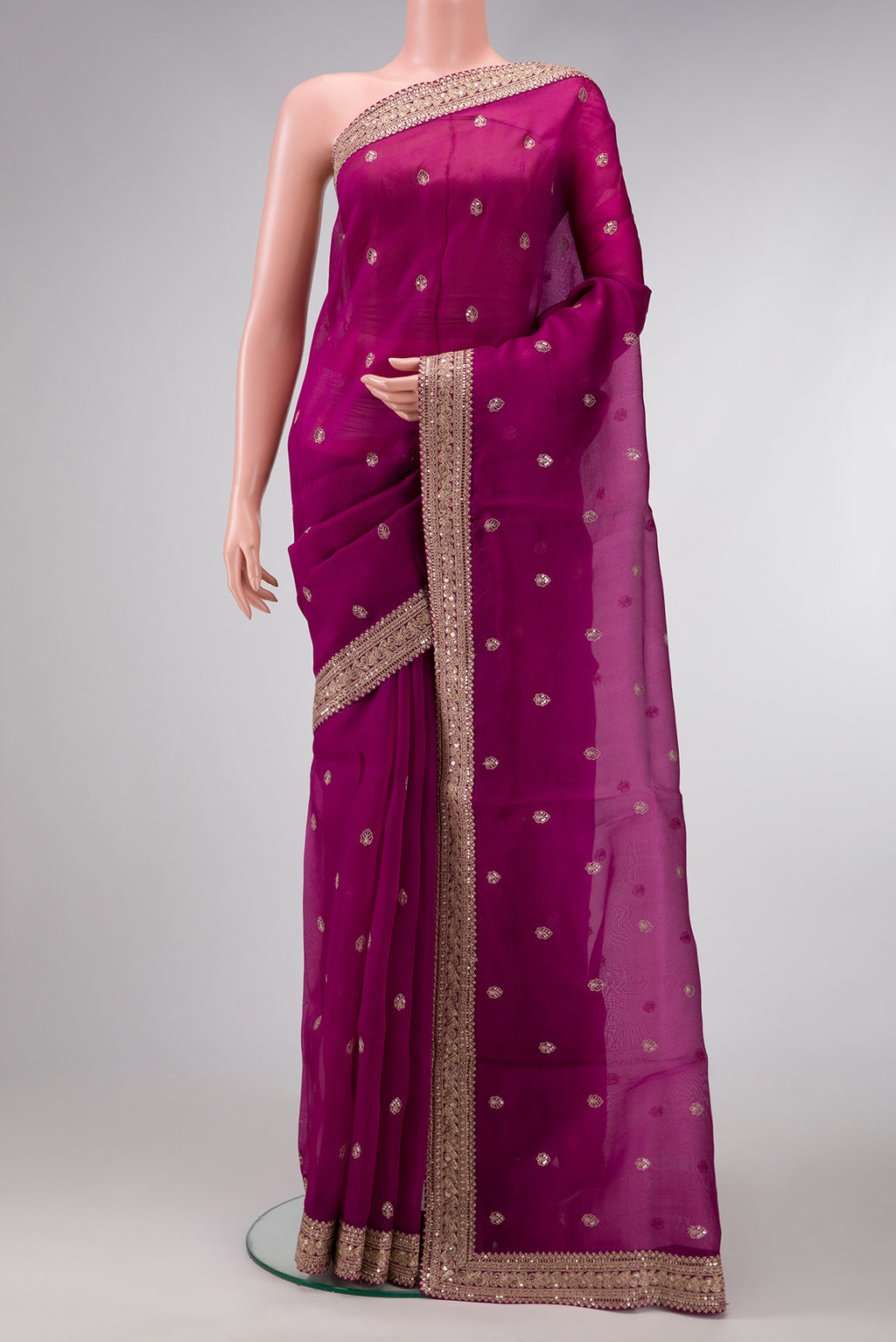 Magenta Dual Tone Organza Silk Saree with Embroidery on the body and Embroidery Border.  displayed on a mannequin