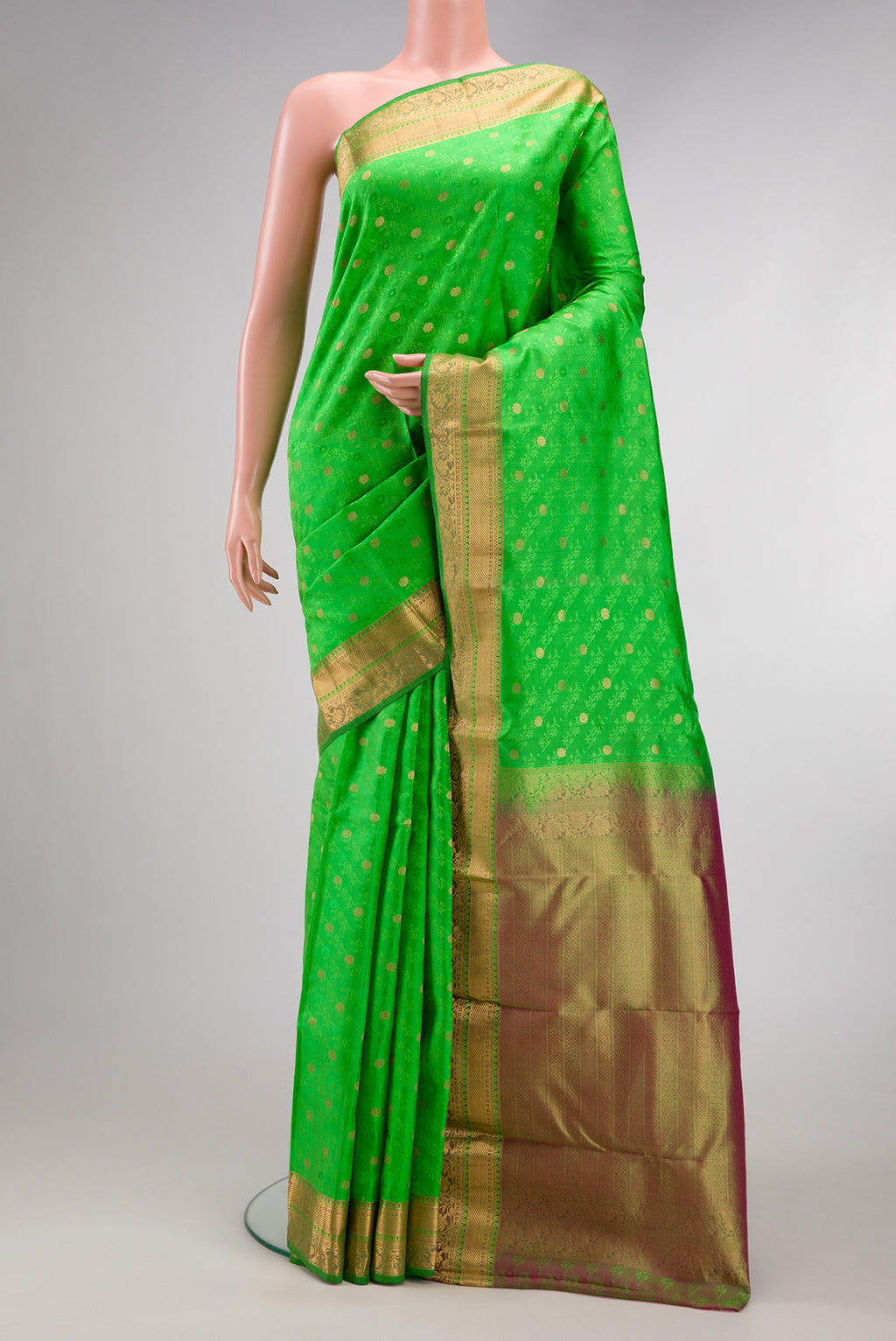 Parrot Green Dual Tone Kanchipuram Silk Saree with Jacquard With Zari Butta on the body and Zari Border.  displayed on a mannequin