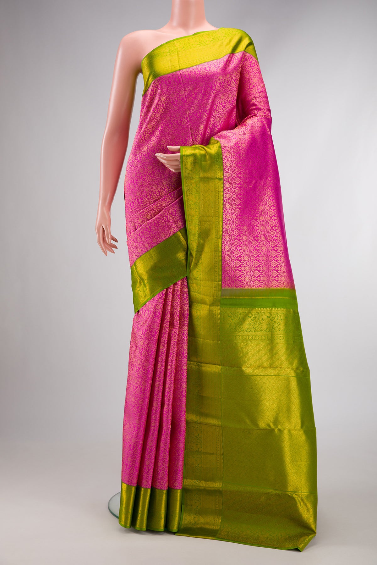 Pink Dual Tone Kanchipuram Silk Saree with Zari Brocade on the body and Zari Border.  displayed on a mannequin