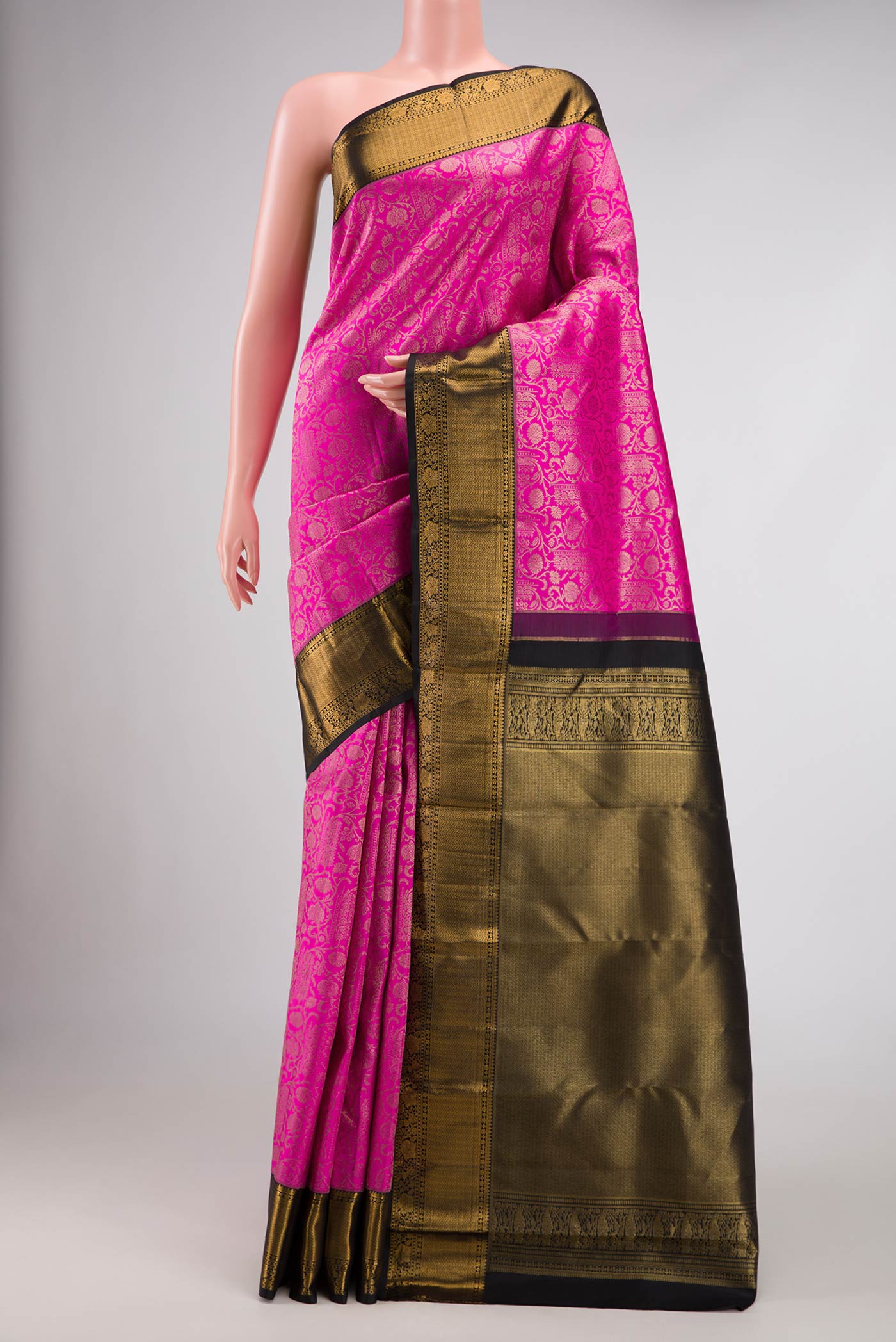 Pink Dual Tone Kanchipuram Silk Saree with Zari Brocade on the body and Zari Border.  displayed on a mannequin