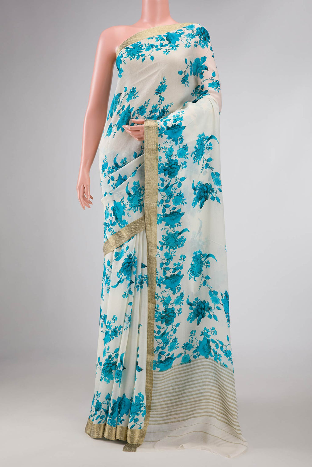 White Mysore Georgette Saree with Floral Print on the body and Zari Border displayed on a mannequin
