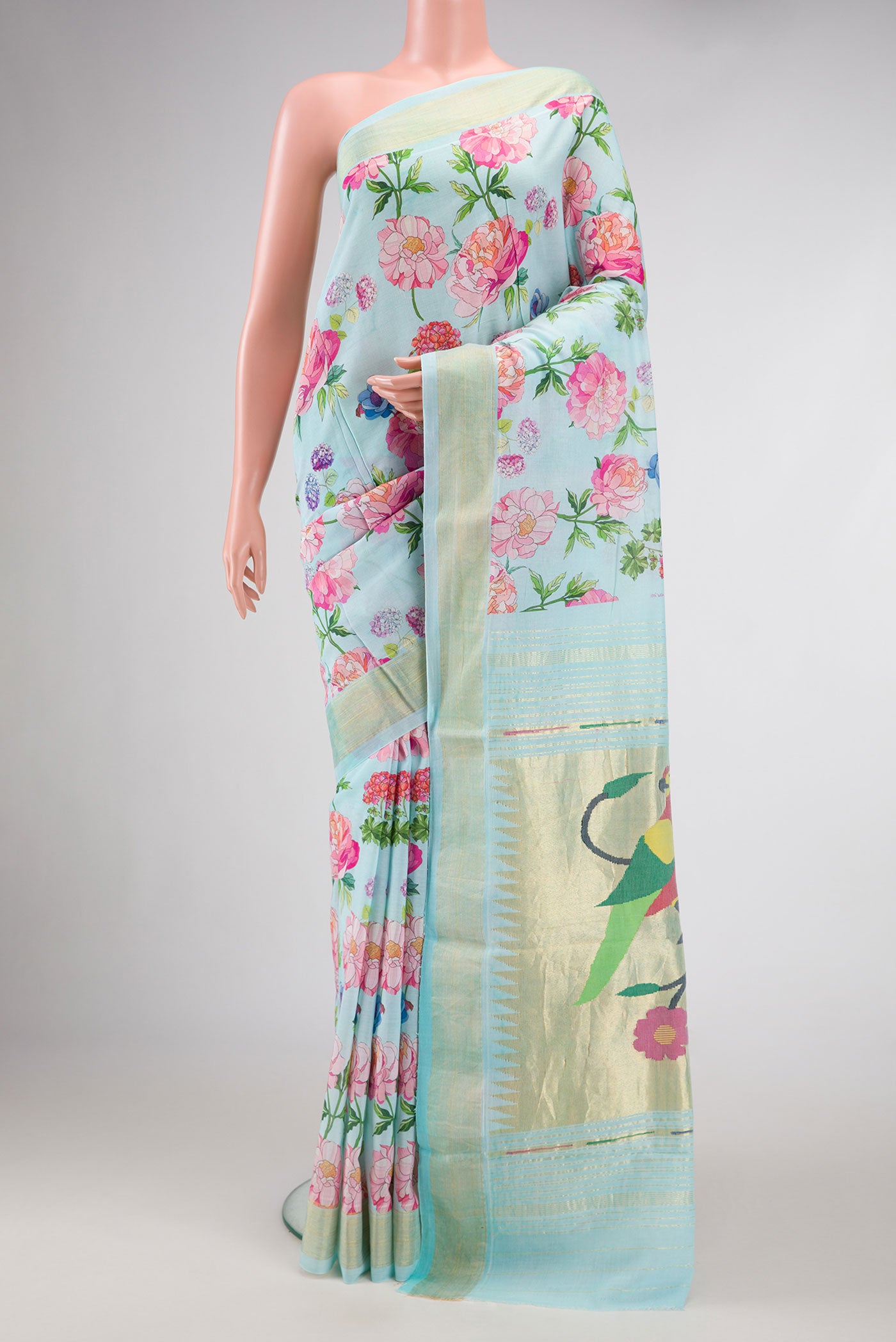 Sky Blue Dual Tone Linen Saree with Printed design on the body and Zari Border.  displayed on a mannequin