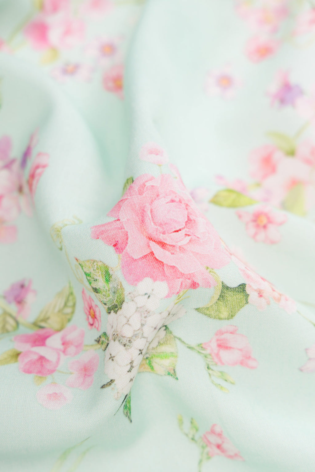 Close up of Sea Green Dual Tone Linen Saree with Printed design on the body and Zari Border.  displaying folds