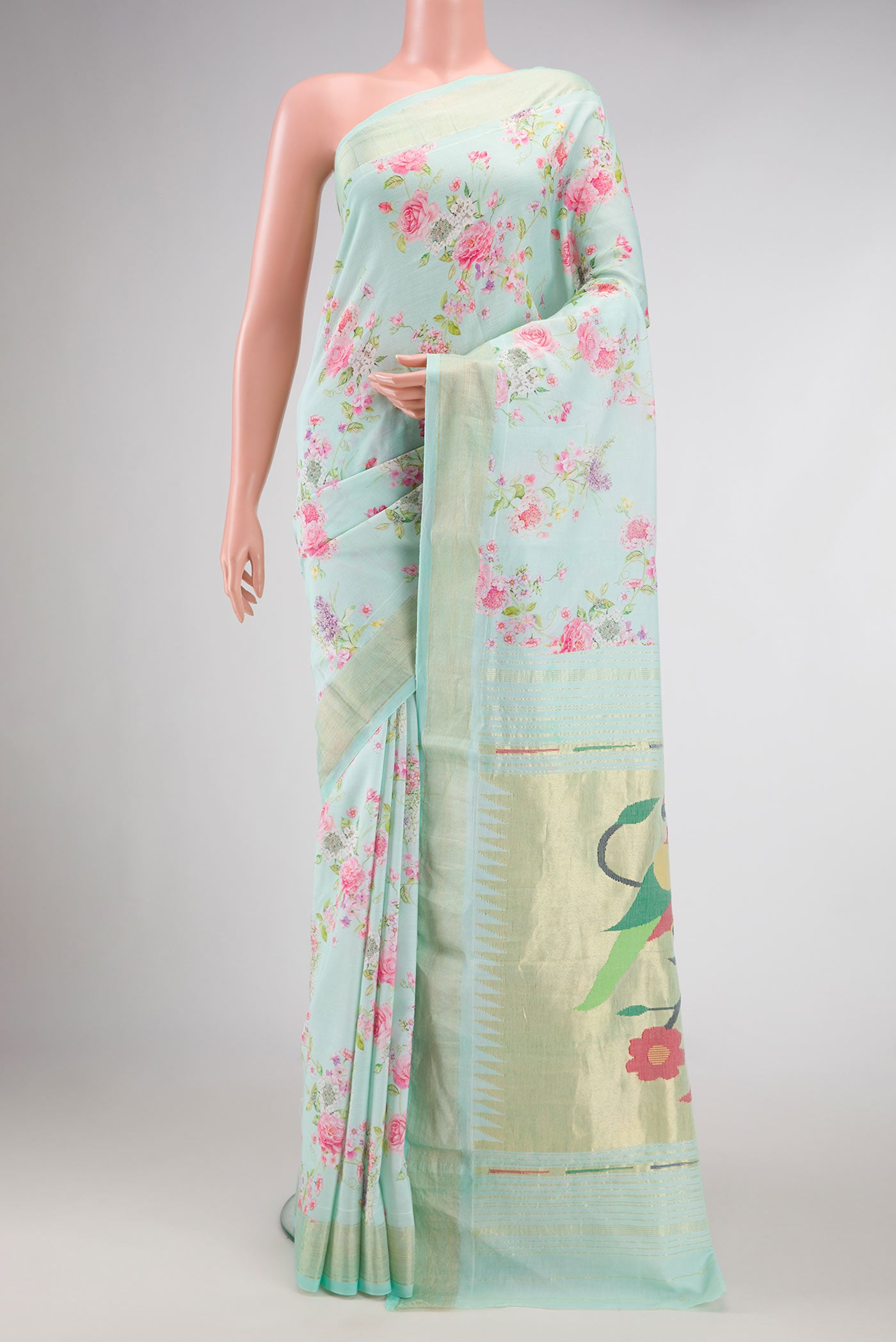 Sea Green Dual Tone Linen Saree with Printed design on the body and Zari Border.  displayed on a mannequin