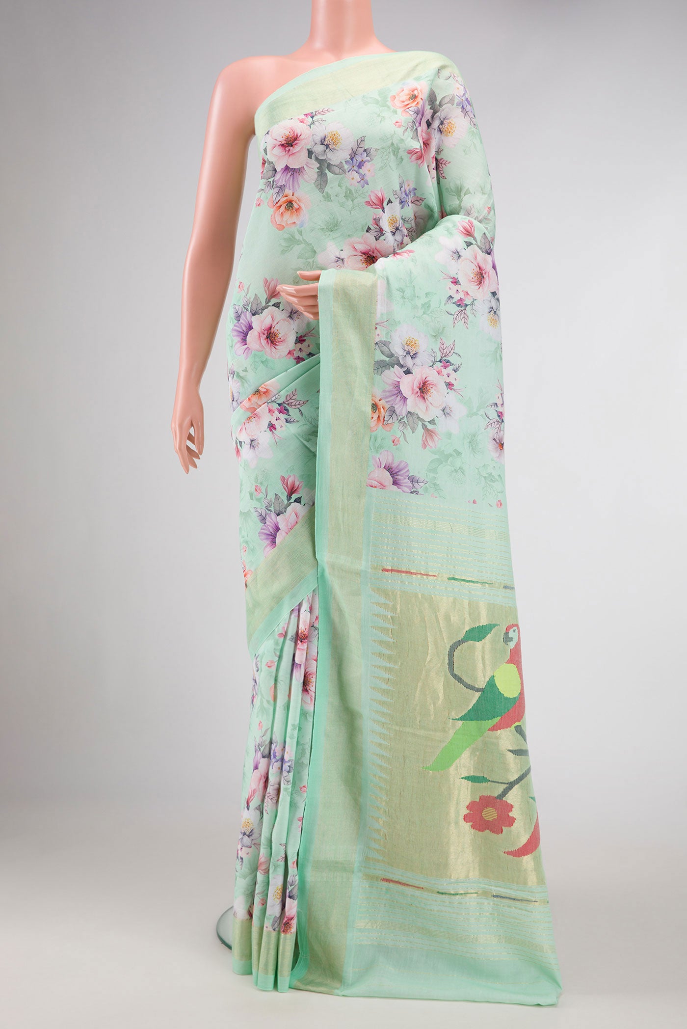 Sea Green Dual Tone Linen Saree with Printed design on the body and Zari Border.  displayed on a mannequin