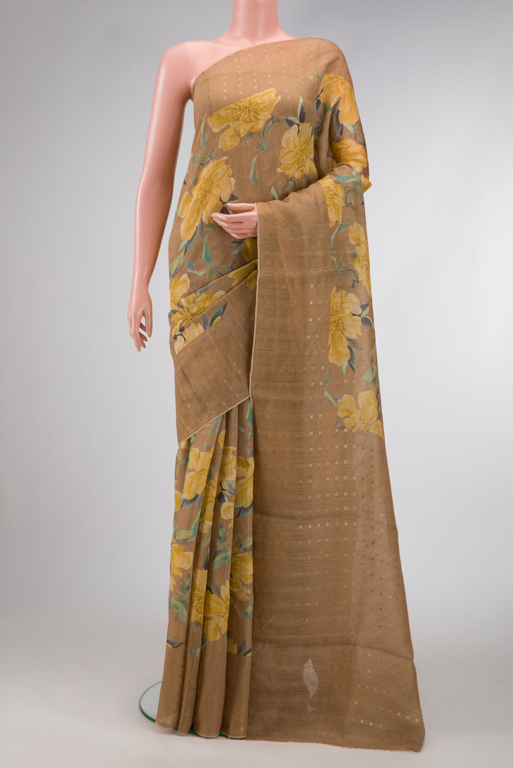 Beige Dual Tone Tussar Silk Saree with Printed design on the body and Embroidery Border.  displayed on a mannequin