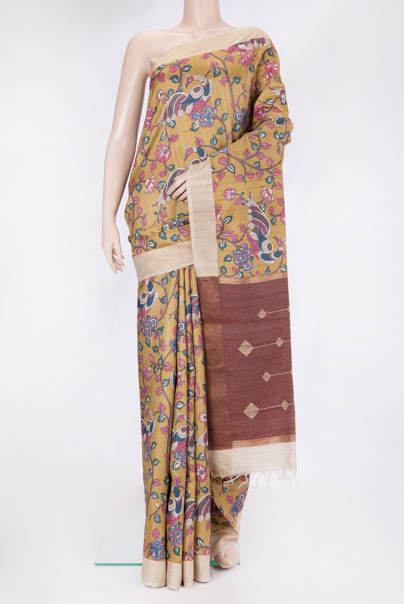 Dark Blue Tussar Silk Saree with kalamkari Print on the body and Zari Border.  displayed on a mannequin
