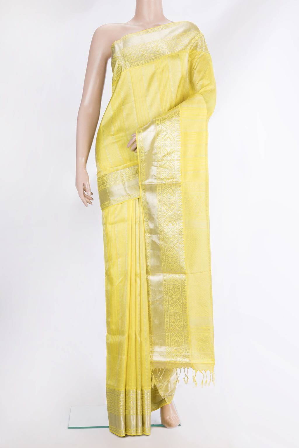 Pure Silk Lemon Yellow Dual Tone Soft Saree with Stripes on the body and Zari Border.  displayed on a mannequin