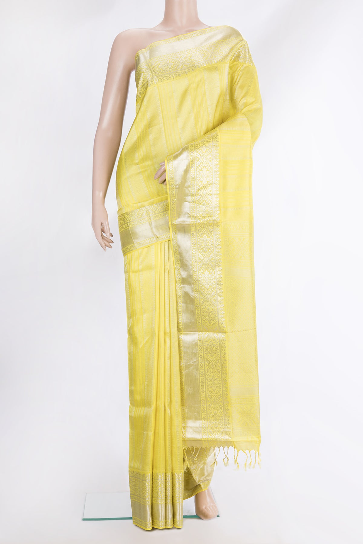 Pure Silk Lemon Yellow Dual Tone Soft Saree with Stripes on the body and Zari Border.  displayed on a mannequin