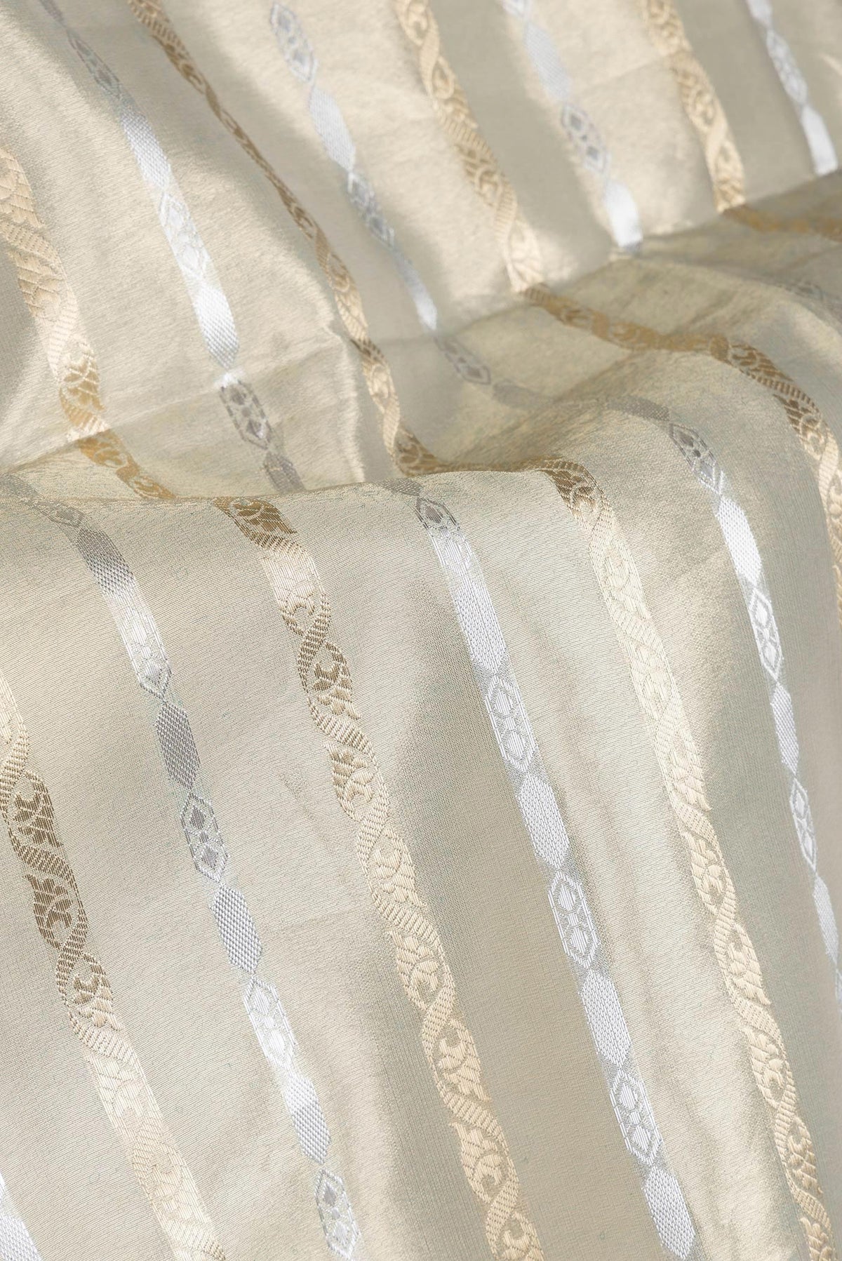 Close up of Pista Green Dual Tone Organza Silk Saree with Stripes on the body and Fancy Border.  displaying folds