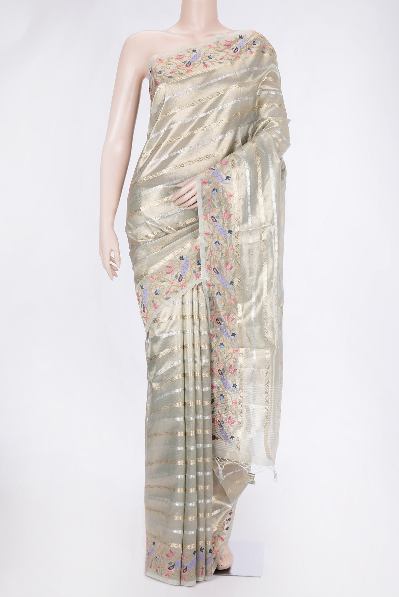 Pista Green Dual Tone Organza Silk Saree with Stripes on the body and Fancy Border.  displayed on a mannequin