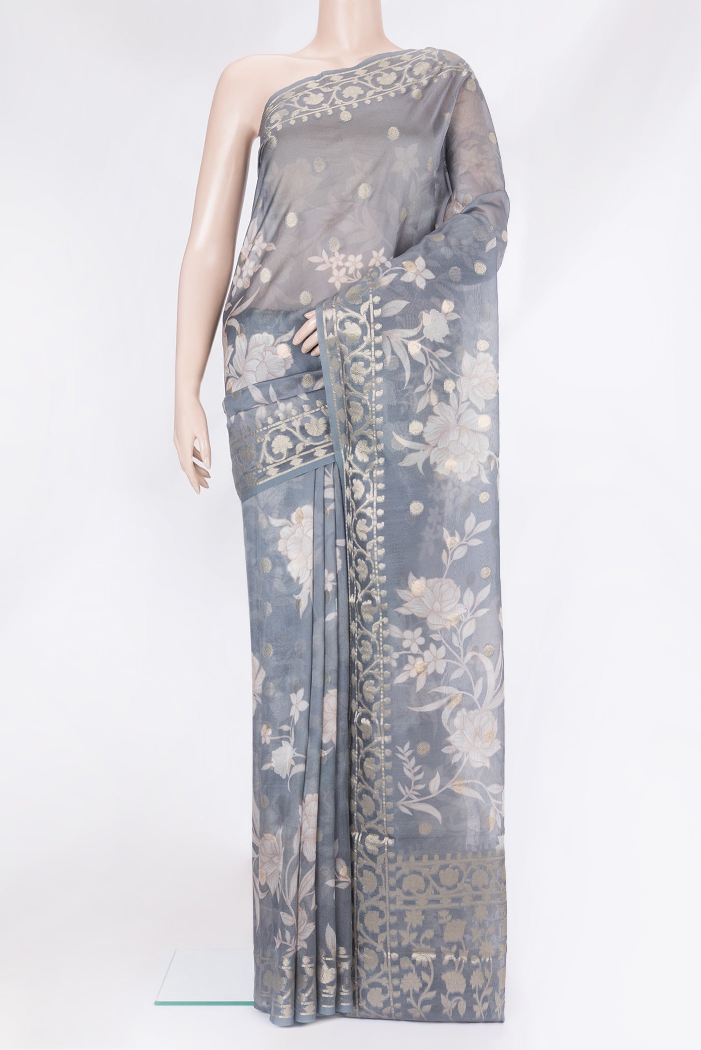 Grey Chanderi Silk Cotton Saree with Printed design on the body and Zari Border.  displayed on a mannequin