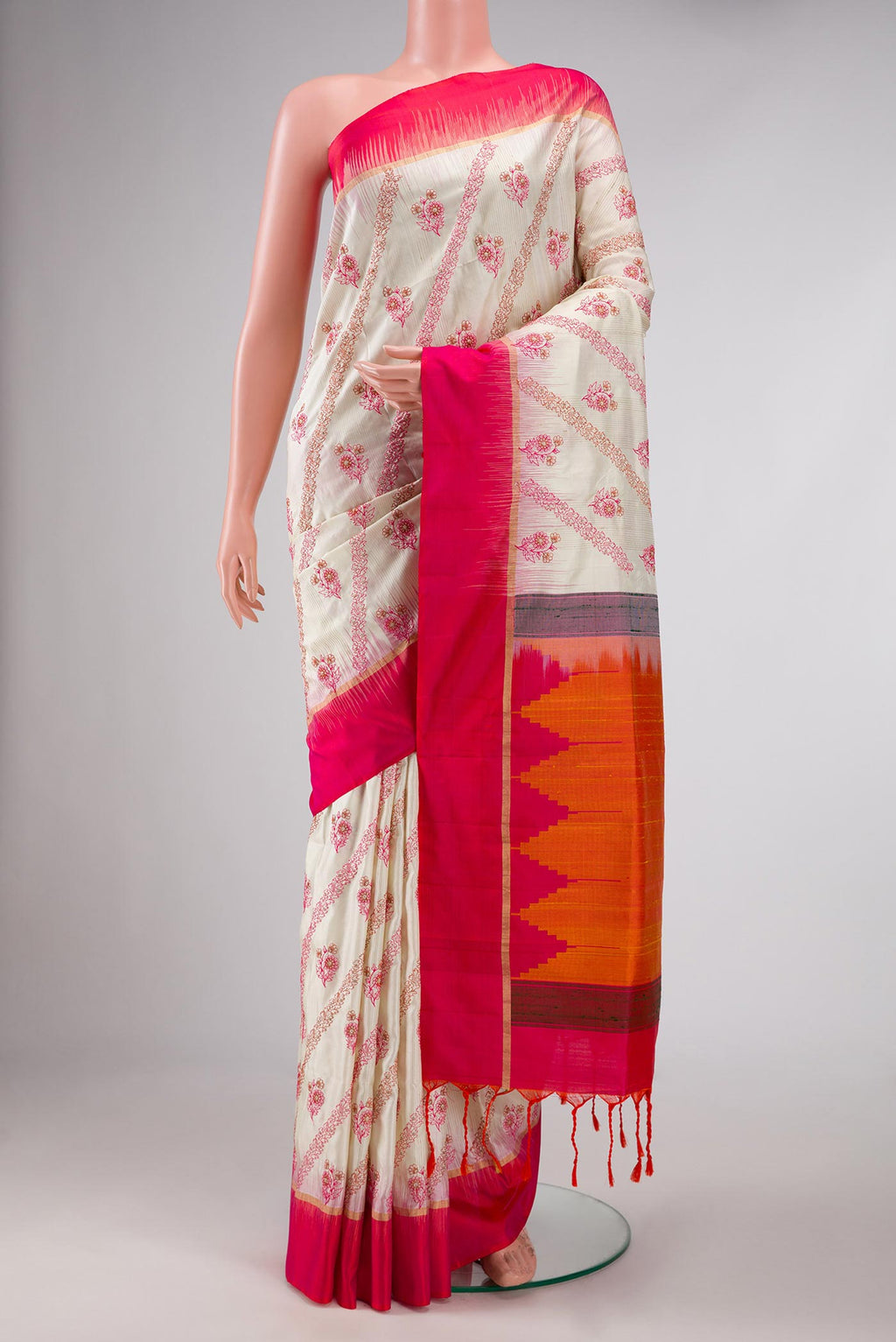 Off White Soft Silk Saree with Embroidery on the body and Plain Border displayed on a mannequin