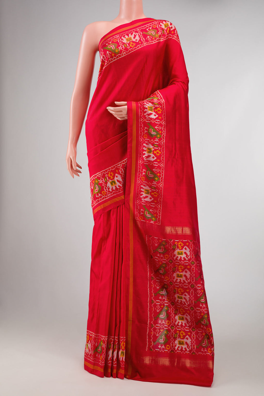 Red Dual Tone Double Ikat Saree with Plain Body and Ikat Border displayed on a mannequin