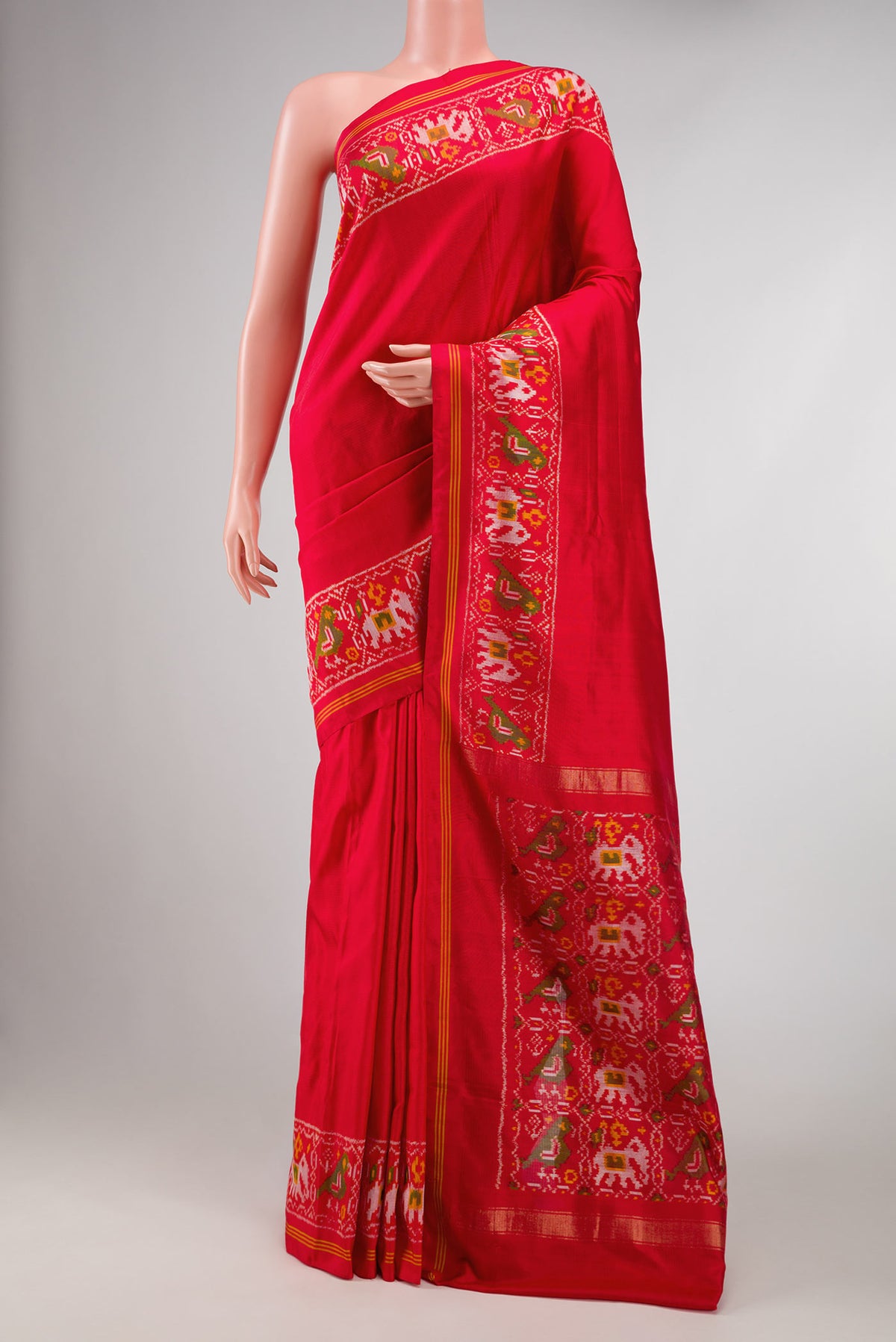 Red Dual Tone Double Ikat Saree with Plain Body and Ikat Border displayed on a mannequin