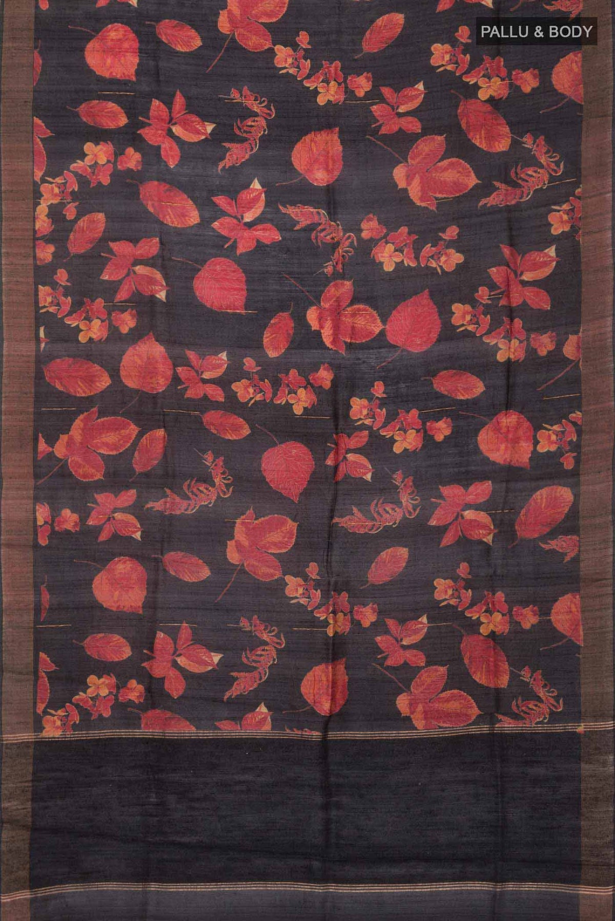 Flat view of Black Tussar Silk SareePrinted design on the body and Zari Border